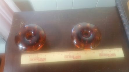 2 amber colored glass candle holders