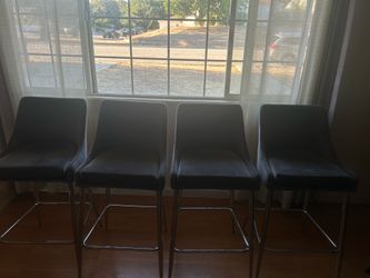 Gray leather sofas and soft chairs