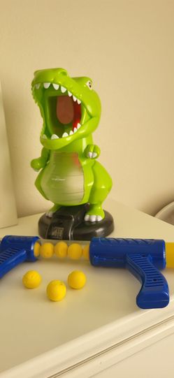 dinosaur ball‑blaster toy.