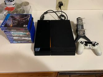 Sony PlayStation 4 Console Bundle with Controller, Charging Dock, and 10 Games