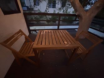 Outdoor wood table and two chairs