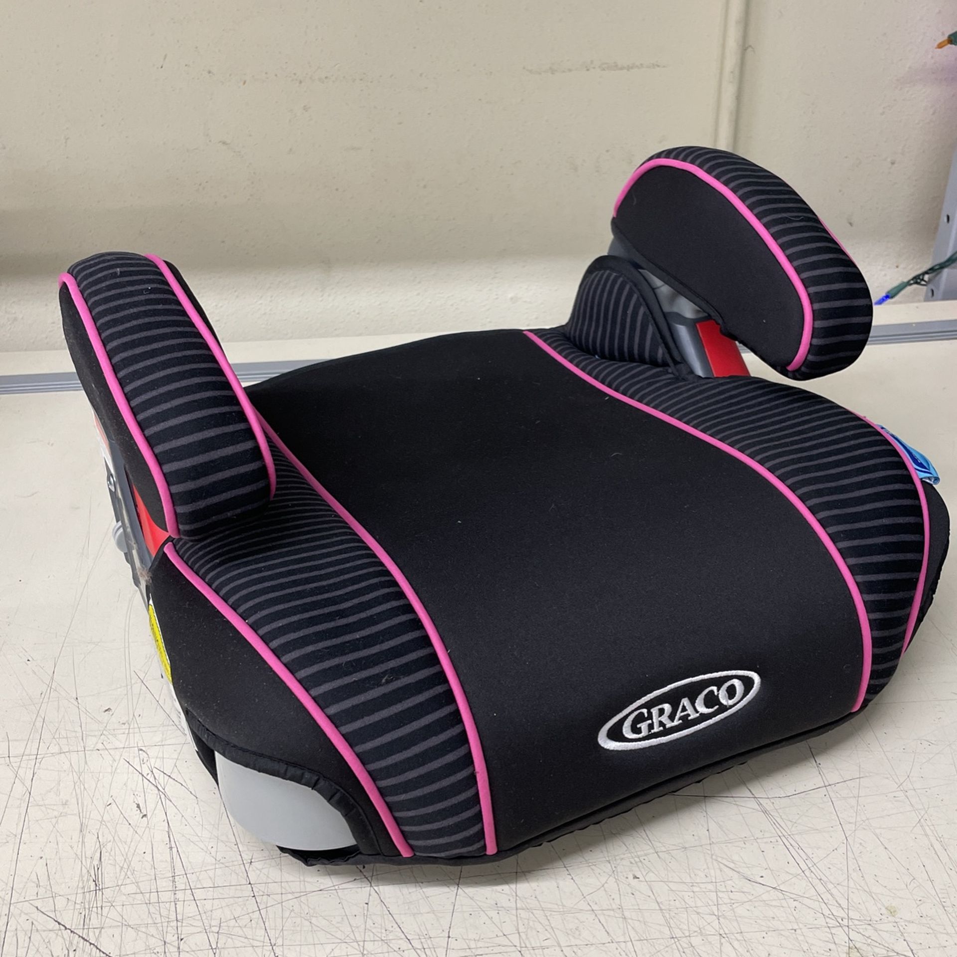 Graco pink and black car booster seat