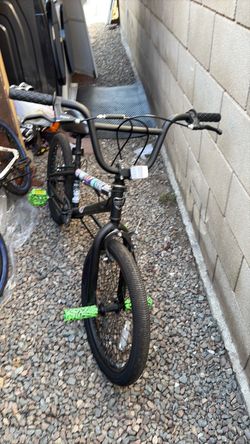 Black BMX Bike with Green Pegs