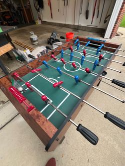 Foosball Table with Red and Blue Players