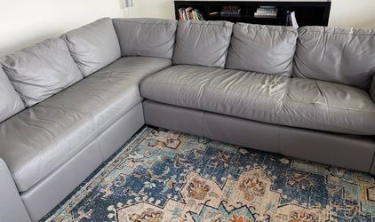 Grey leather sectional couch