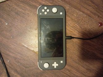 Lightly used Nintendo switch lite w/zelda breath of the wild