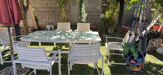 Aluminum table with glass top and six chairs