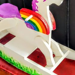 Handcrafted wooden painted rainbow rocking horse