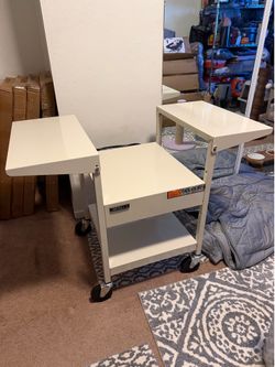 Apollo AV/computer cart with two folding side shelves and a built-in power strip. • Overall width (with both side shelves up): about 48 inches • Main 