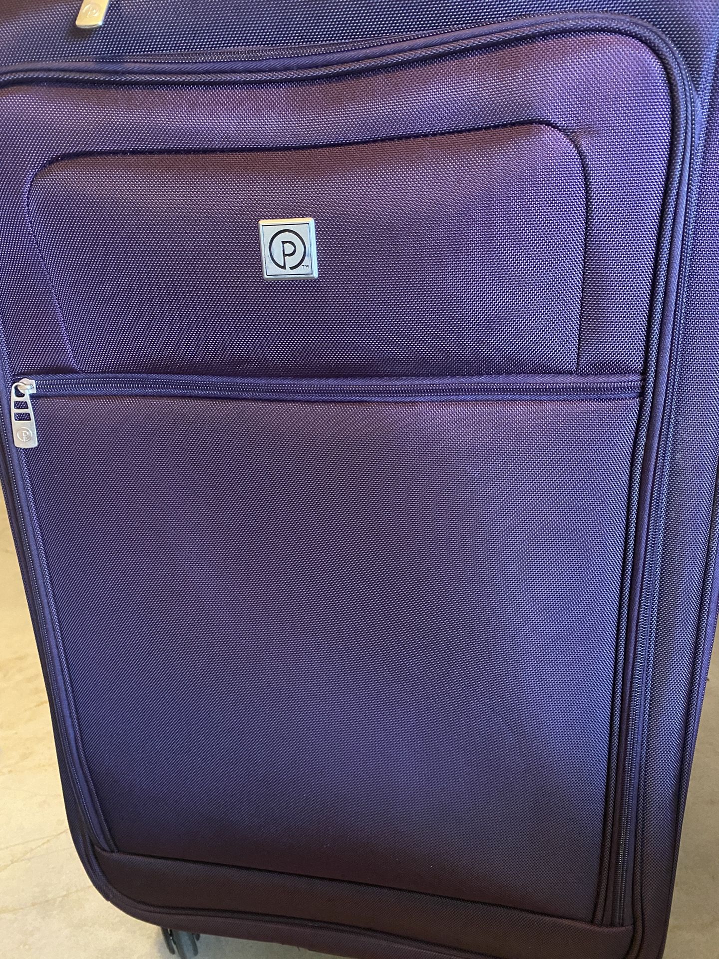 Protégé Purple Soft Side Luggage Spinner Wheels Wet Pocket Outside Pockets