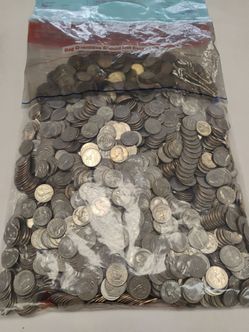 $500 face bags of unsearched quarters, guaranteed at least one silver.