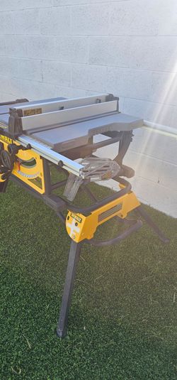 Used, WORKS WELL.  DEWALT
15 Amp Corded 10 in. Job Site Table Saw with Rolling Stand