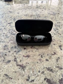 Revo Sunglasses with case and cleaning cloth.