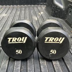 PAIR  OF  TROY  50 LB.  BARBELL  12  SIDED  URETHANE  RUBBER  DUMBBELLS. 