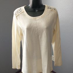 NorthCrest small ribbed cream colored long sleeve top
Lace accents on shoulder of blouse and upper middle back
