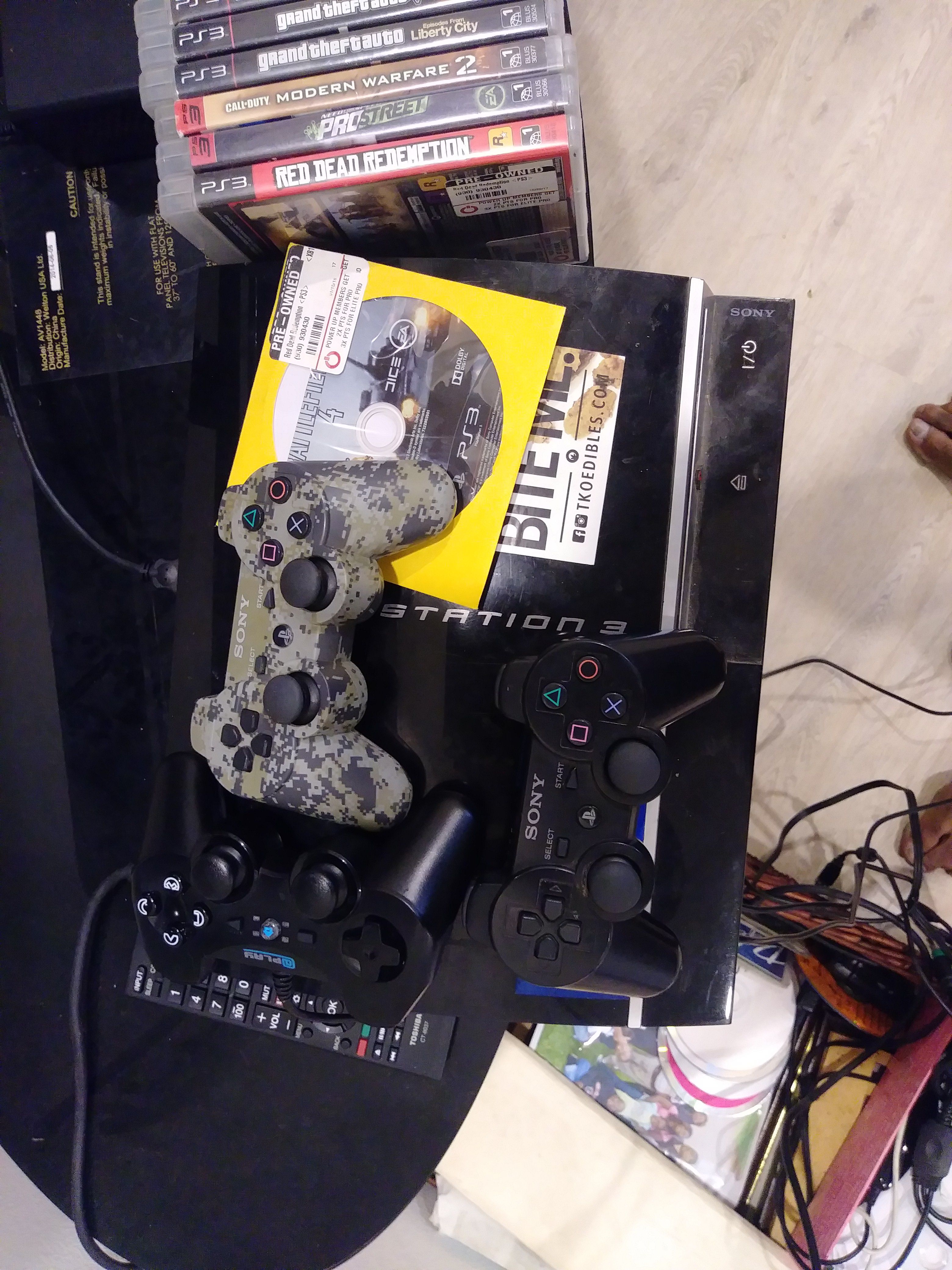 Ps3, games and console with cords and an online account
