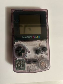 Nintendo Game Boy Color - Atomic Purple with matching pelican accessories and Nintendo case