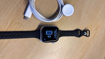 Apple iWatch series 10 42mm, with charging dock.