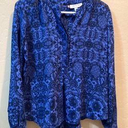 Woman’s Blouse by Jennifer Lopez, size Petite Large, blue print with black rhinestones on shoulders, worn once, excellent condition..100% polyester