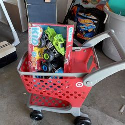 Shopping Cart For A Baby And A Toy Inside Of It