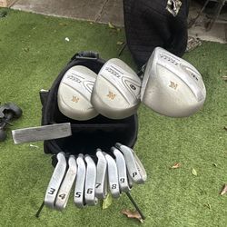 complete set of golf clubs and bag, and a dozen titliest golf balls