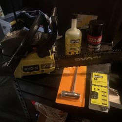 16” Ryobi Chainsaw W/ New Chain,  Bar Oil, And Chainsaw Tool