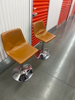Pair of Tan Faux Leather Adjustable Bar Stools
