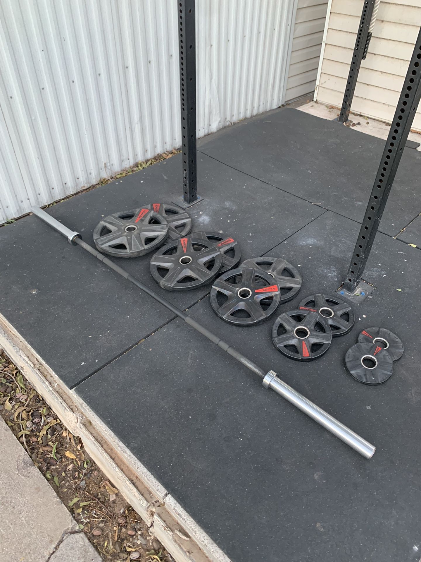 45lb XMARK Barbell with 240lbs of Weight Plates