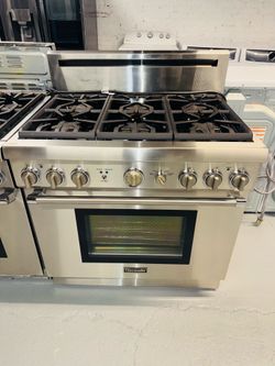 Thermador stainless steel natural gas stove; includes a receipt for a 90-day warranty.