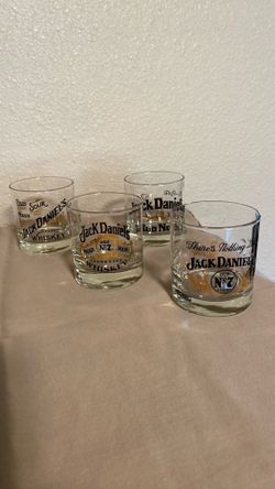 Jack Daniel’s glasses. Set of four. Black and gold trim