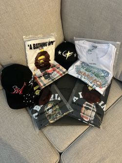 CT galaxy barbas hat, 31 x el mago hat, Burberry white and black a bathing ape, all black essentials shirt and white Kenzo tiger shirt