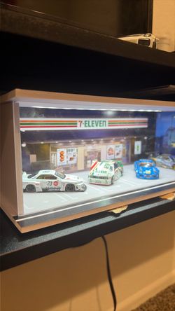 7/11 display case with cars
