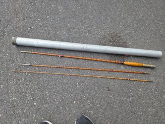 Old bamboo fly fishing pole with aluminum tube