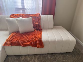 White tufted sectional sofa