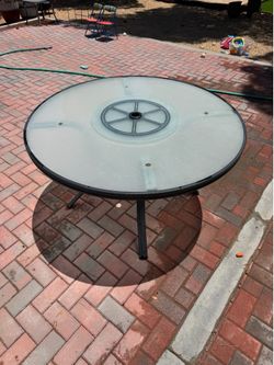 Round glass top patio table