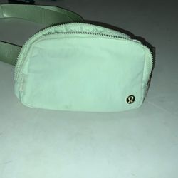 lululemon pastel green cross body bag with gold zipper