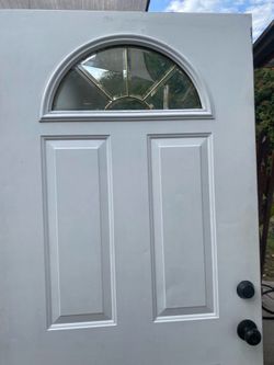 Exterior entry door with door handle and deadbolt & key