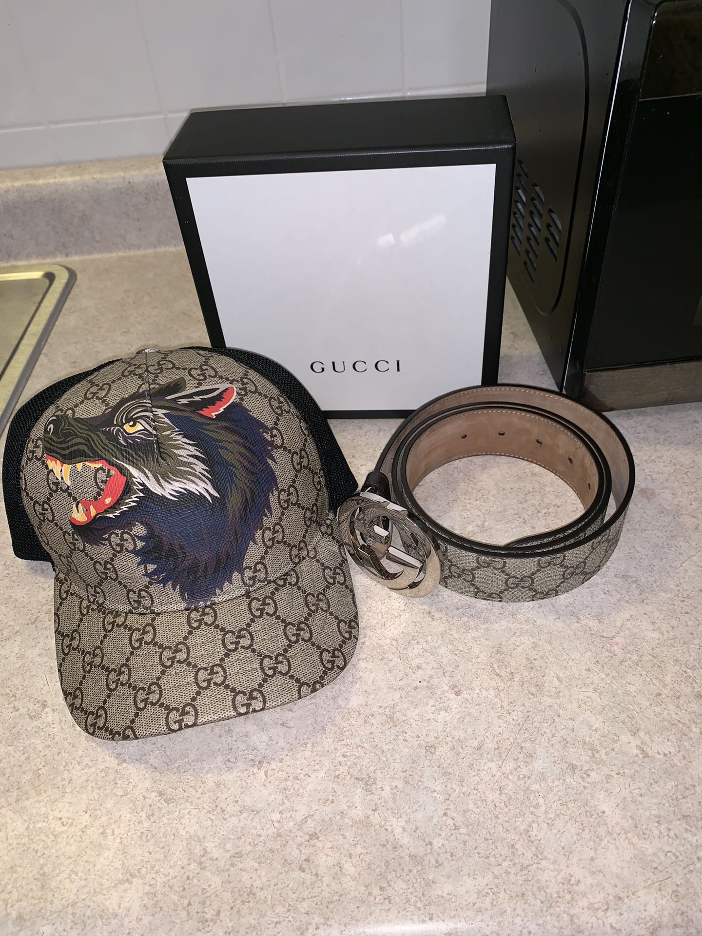 Hat sold . Gucci belt still available