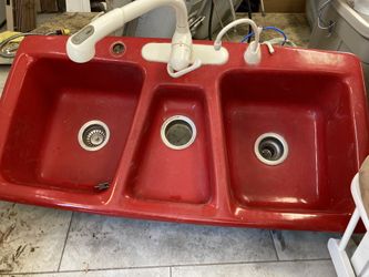 Red sink with faucets - cast iron