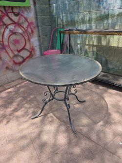 Glass topped patio table