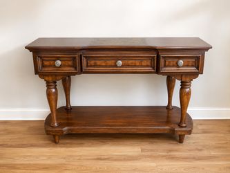 Brown wood entry table with stone top