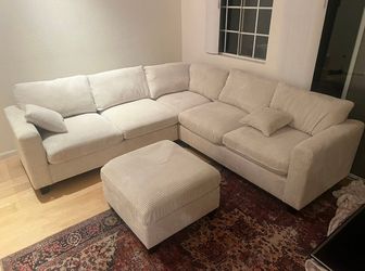 Ivory corduroy sectional sofa with ottoman 