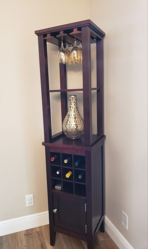 This piece is a corner bar cabinet or wine tower, commonly referred to as a:
> Corner Wine Cabinet with Glass Rack & Bottle Storage