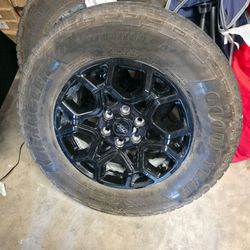 Stock rims and tires.