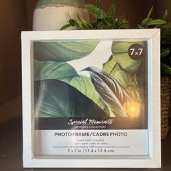 14 white photo frames 7” x 7”