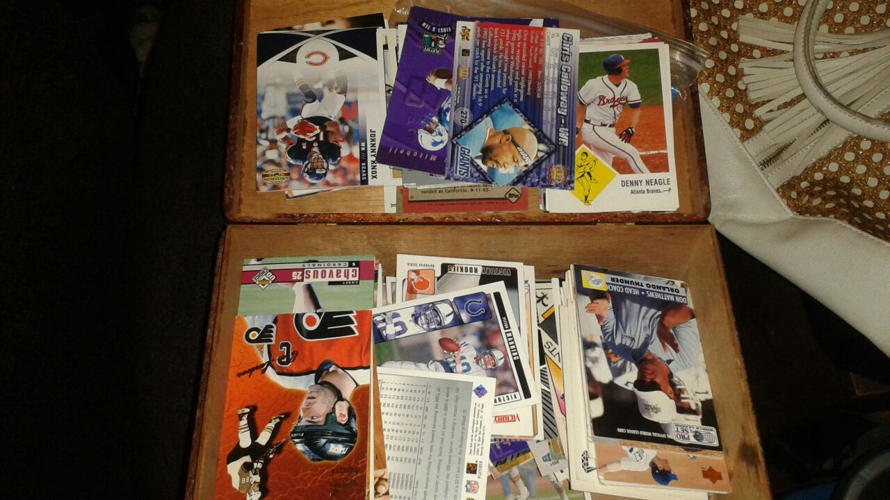 Box of various sports card of various ages