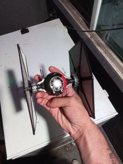 Starwars tie-fighter with lights and sounds and a vintage TMNT figure and horror movie character