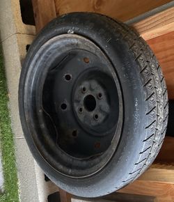 Temporary use spare tire for Toyota Corolla. 4 bolt pattern. Never used