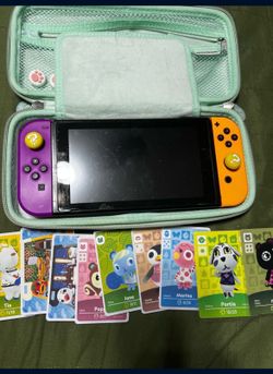 Nintendo Switch with 1 Game , 12 amiibos, dock and SD card