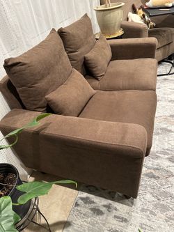 Brown love seat sofa